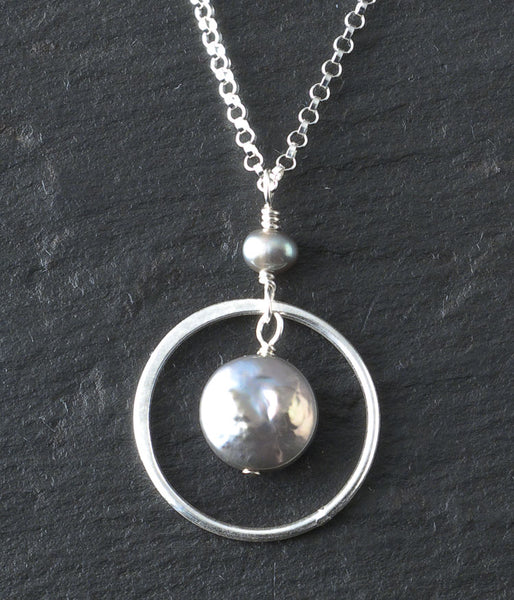 Freshwater pearl, sterling silver. 

Necklace (adjustable), 16 - 18"
