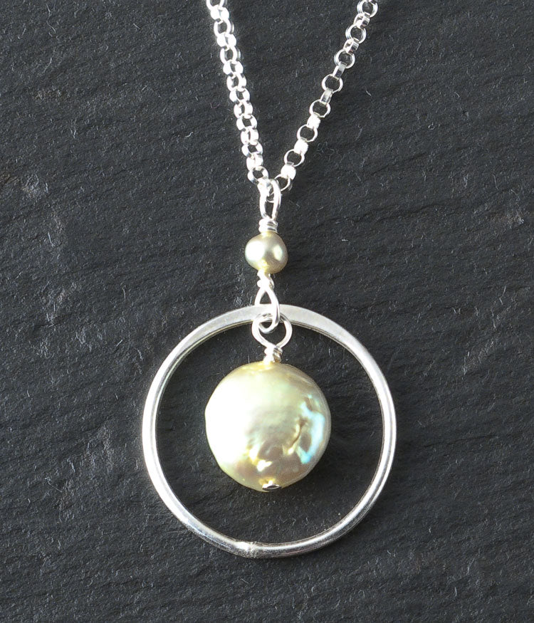 Freshwater pearl, sterling silver.
Necklace (adjustable), 16 - 18"