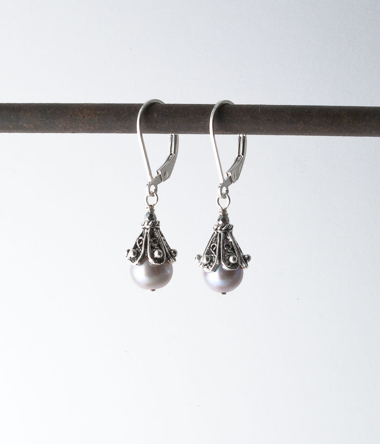 Freshwater pearl, Balinese sterling. 
Earrings, 1.25"
