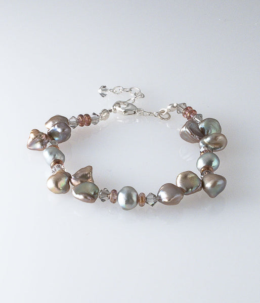 Keishi and freshwater pearl, Austrian crystal, Czech glass, sterling silver. 

Bracelet (adjustable) approximately 7-8"
