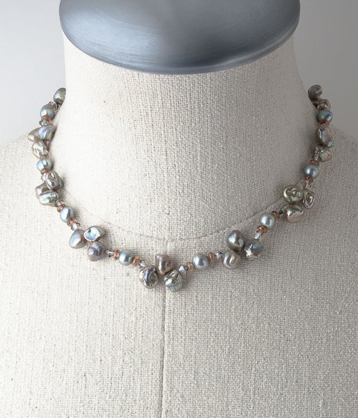 Keishi and freshwater pearl, Austrian crystal, Czech glass, sterling silver. 

I love the versatility of this piece. The keishi have so much luster, the pearls almost look metallic. This will be a great addition to any accessory collection. 

Necklace (adjustable), approximately 17-19"
