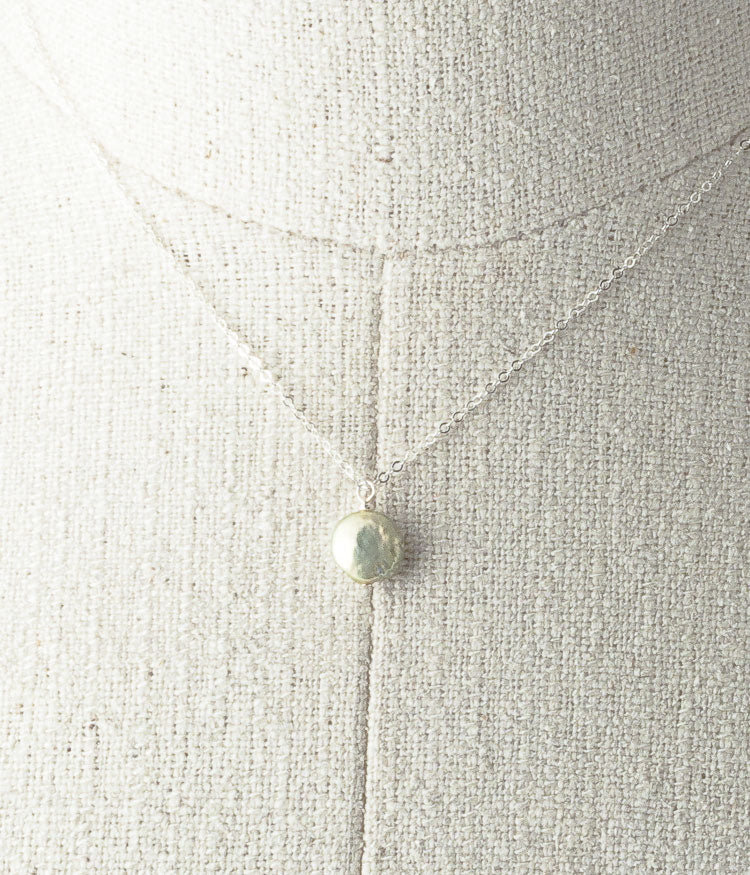 Freshwater pearl, sterling silver. 

Necklace 16" or 18"