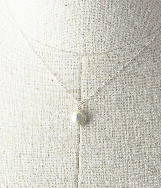 Freshwater pearl, sterling silver. 

Necklace 16" or 18"